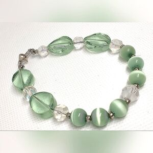 Light green and white glass bracelets 7" each one Bungie, one wire
